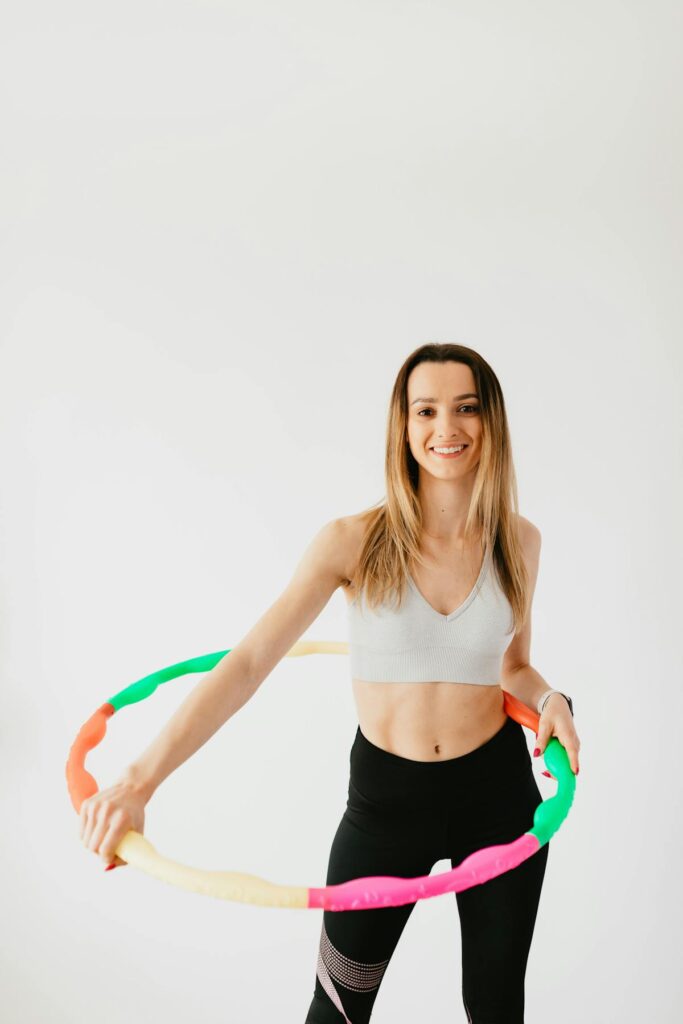 woman measuring waist progress